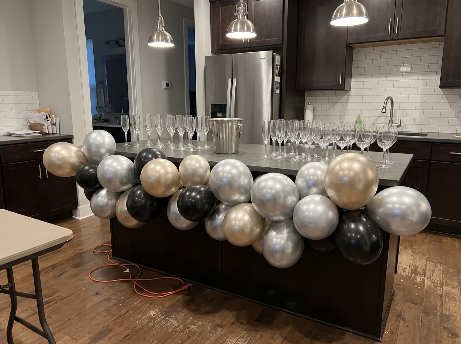 Chrome champagne, silver and black balloon garland for New Year's Eve