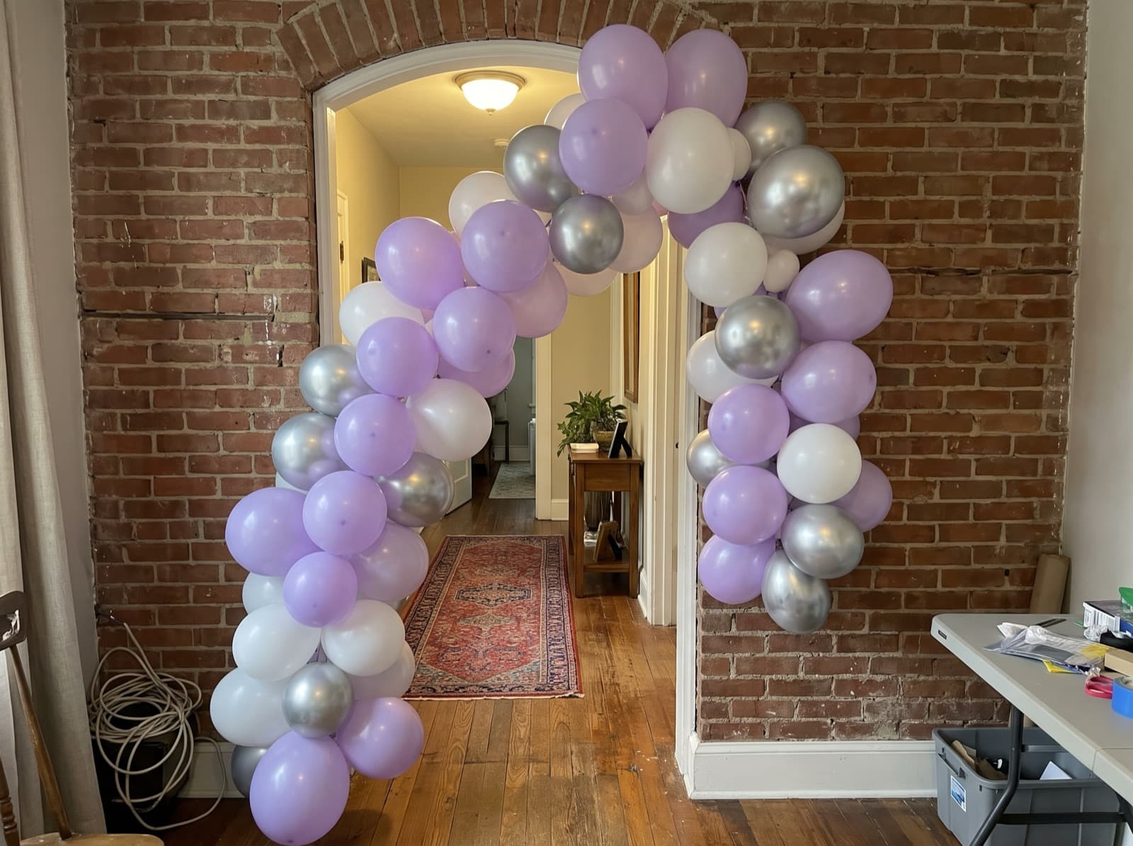 Organic balloon garland around an arched doorway